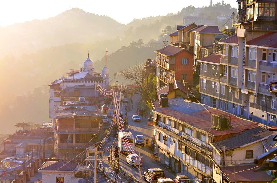 Shimla and the surrounding ridge at sunset, with mist, in Himachal Pradesh