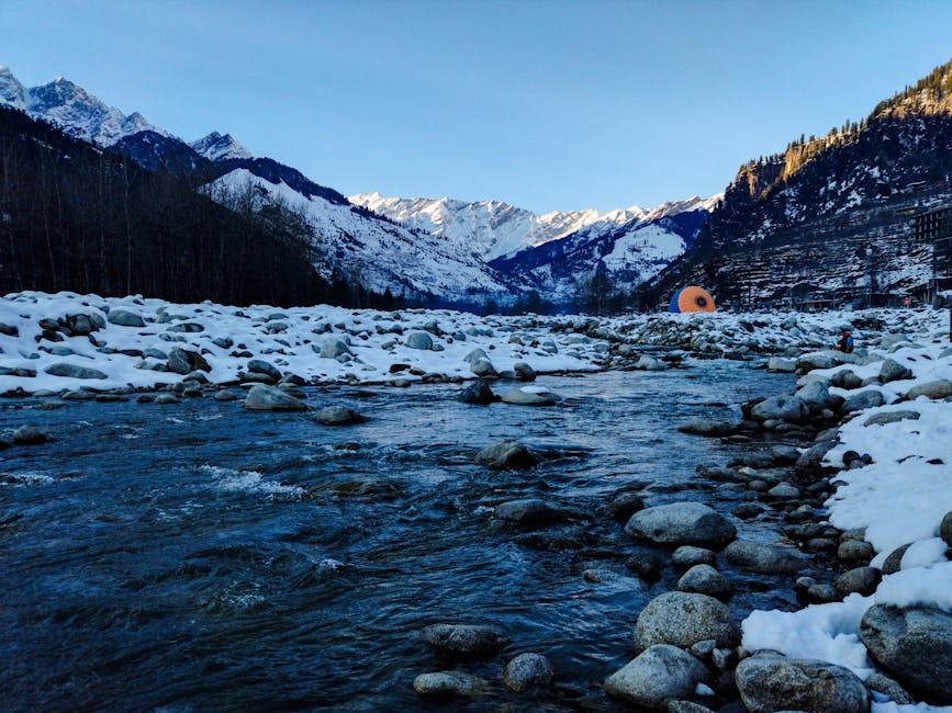 Snow-covered valley and frozen river in Manali, India, in winter