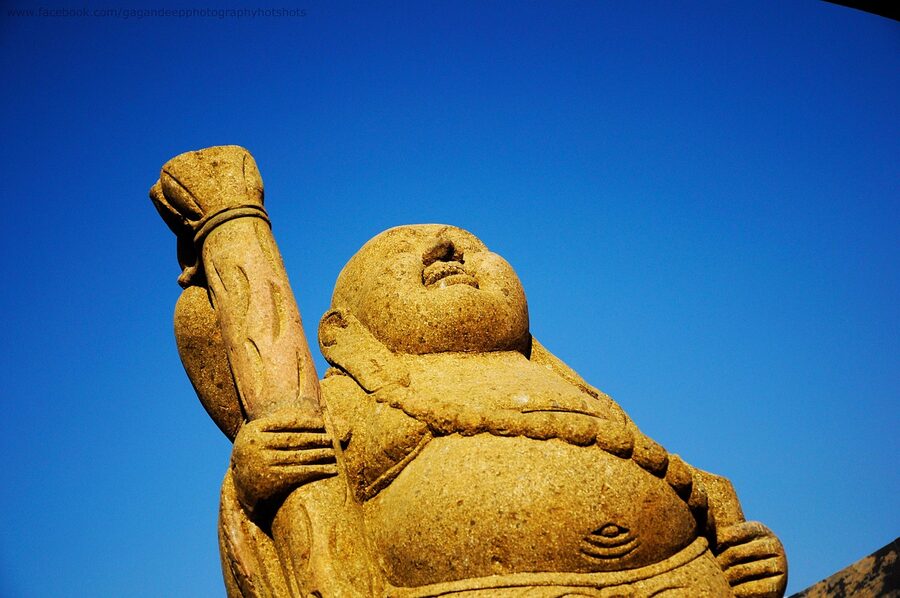 A Buddha statue with prayer beads in Dharamshala, Himachal Pradesh.