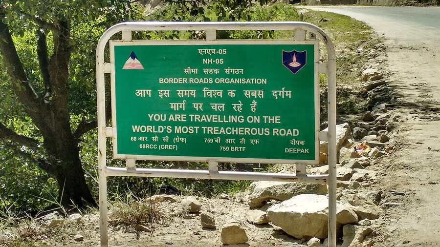A typical narrow Kinnaur road cut into the cliffs above the river