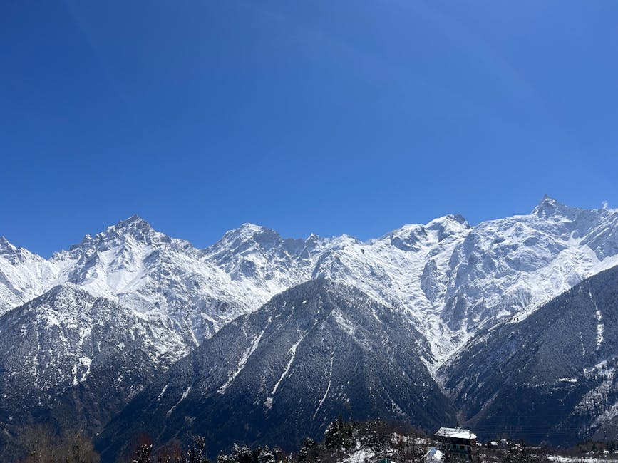 Snowy peaks above Kalpa under a clear blue sky