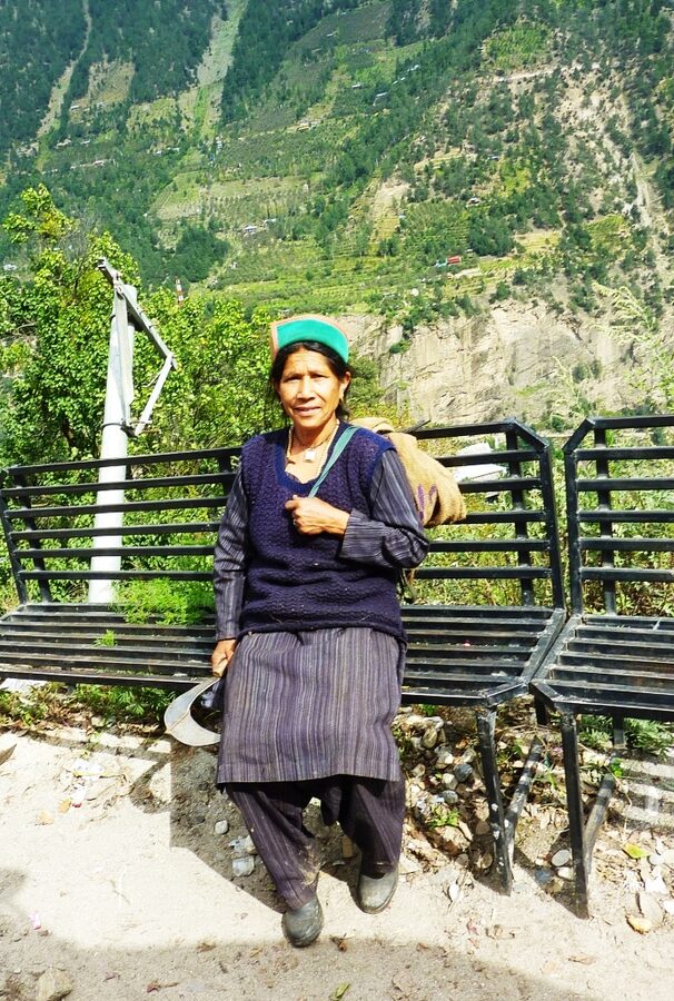 A Kinnauri farm worker wearing the traditional green-bordered Kinnauri topi