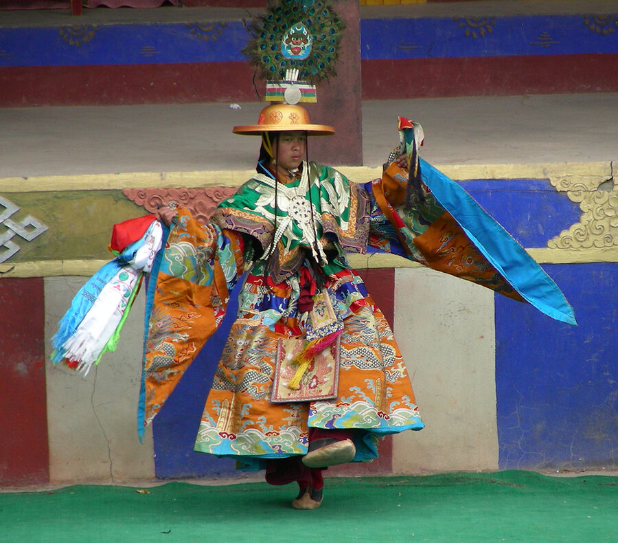 Monk performing the masked Chham dance at Tibetan Losar new year festival.