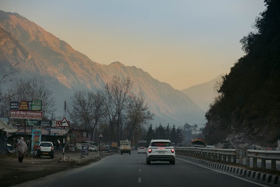 Highway through Kasol, Himachal Pradesh, with mountains