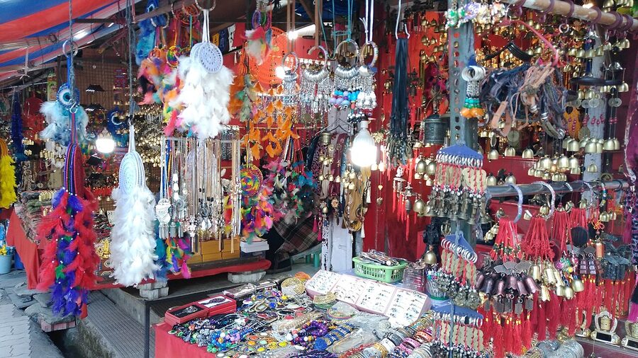 McLeod Ganj market street, Dharamshala, with Tibetan shops and prayer flags