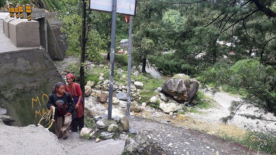 The Parvati Valley near Kasol with the river, deodar forest, and steep slopes rising on both sides.
