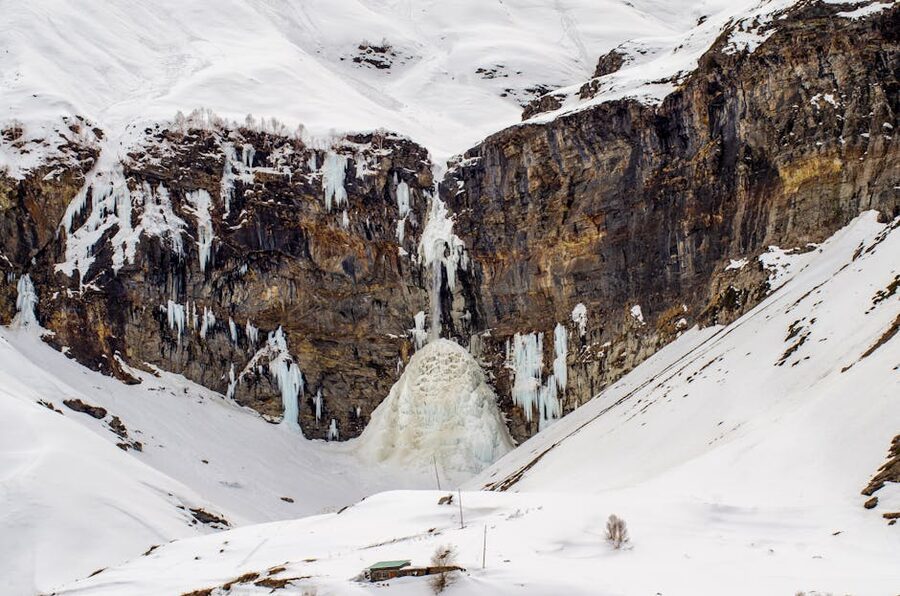 Frozen Sissu waterfall in the snowy Lahaul landscape, Himachal Pradesh.