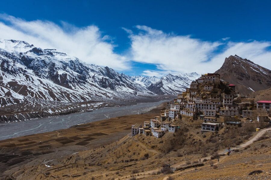Key Monastery atop a hill in Spiti Valley, surrounded by Himalayan mountains.