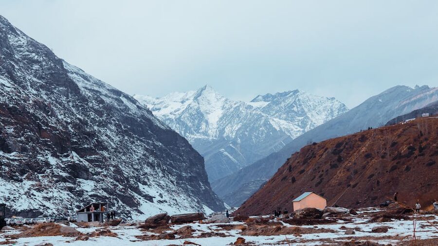 View of Sissu village in the Lahaul Valley below snow-capped Himalayan peaks.