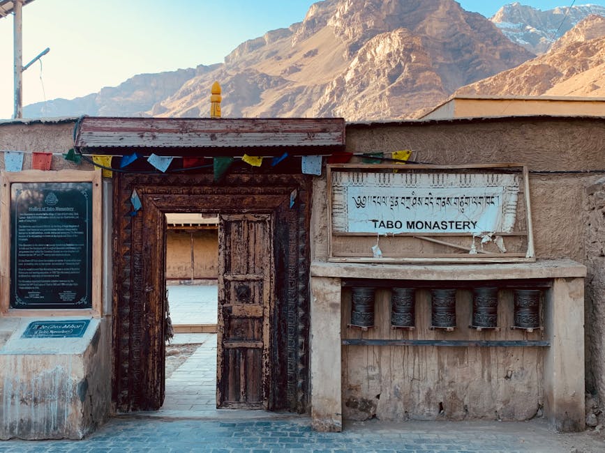 Entrance to Tabo Monastery framed by Himalayan mountains, Spiti Valley.