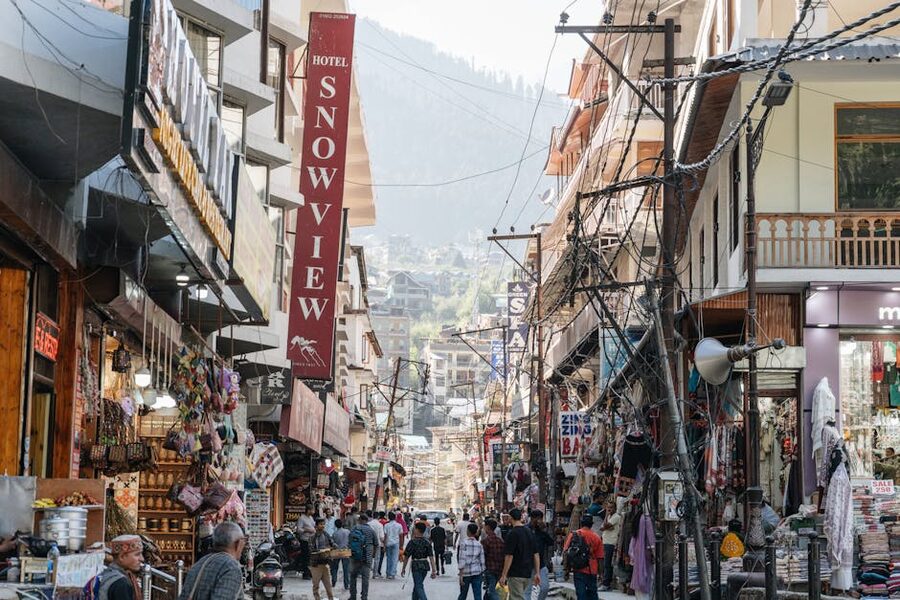 Manali Mall Road and bazaar with shops and weekend foot traffic