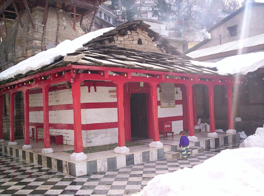 Vashisht temple complex in the village above Manali, with stone shrine and bathing-tank approach