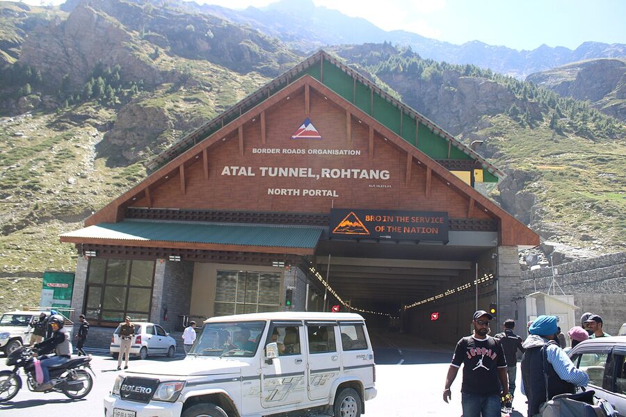 Vehicles climbing the switchback road to Rohtang Pass on the way out of the Manali valley.