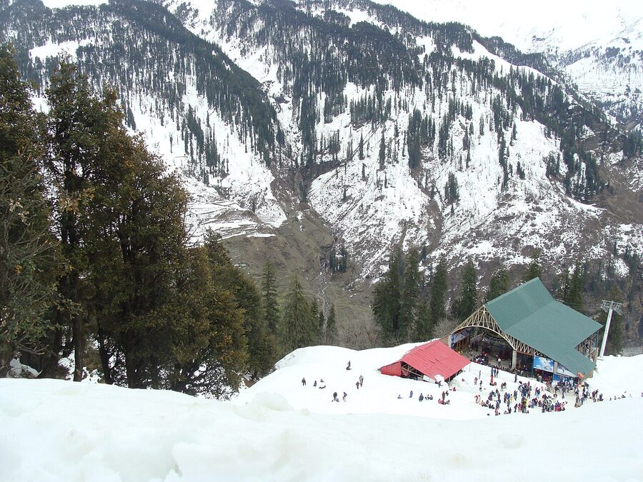 The Solang Valley meadow surrounded by snow-capped Himalayan peaks above Manali.