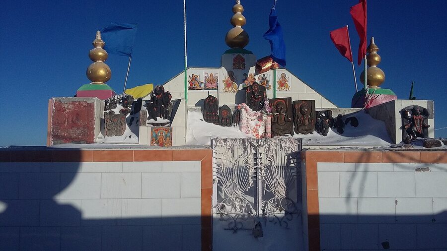 The roofless Shikari Devi temple on a high alpine meadow above Mandi district.