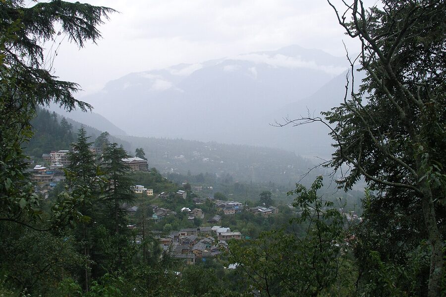Panoramic view of Naggar village on the apple-belt slope above the Beas valley in Himachal Pradesh.