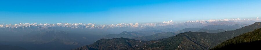 Panorama from Hatu Peak above Narkanda, with snow-capped Himalayan peaks visible to the north.