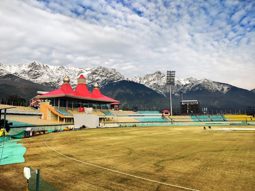 Dharamshala Cricket Stadium with the snow-capped Dhauladhar range behind, Himachal Pradesh.
