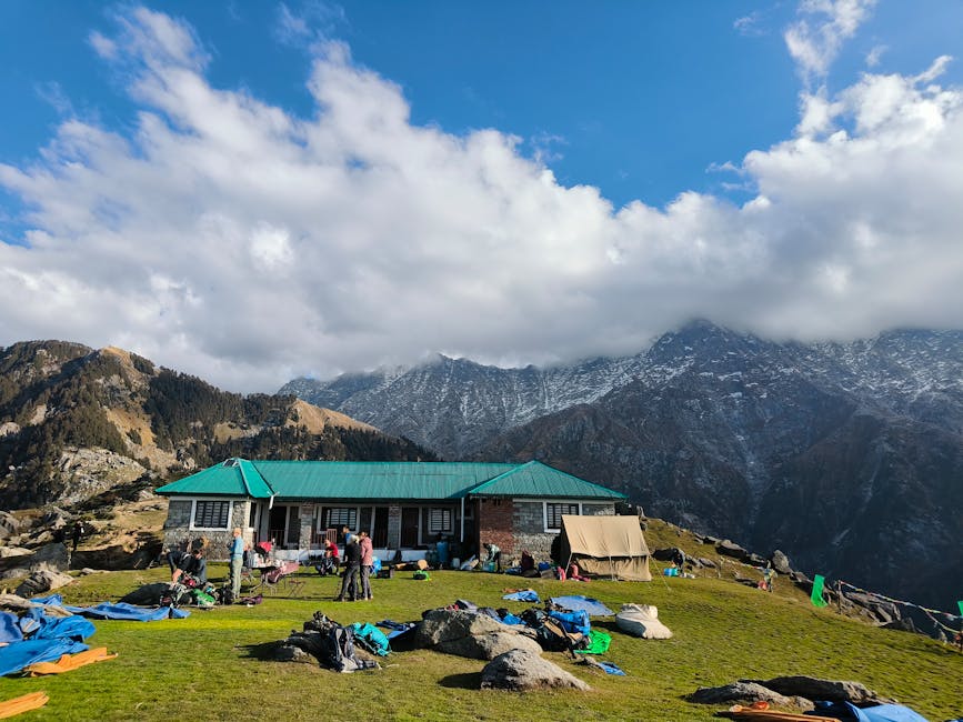 Trekkers and tents in a Himachal mountain camp