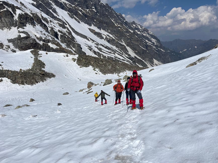 Trekkers crossing Hampta Pass in snow