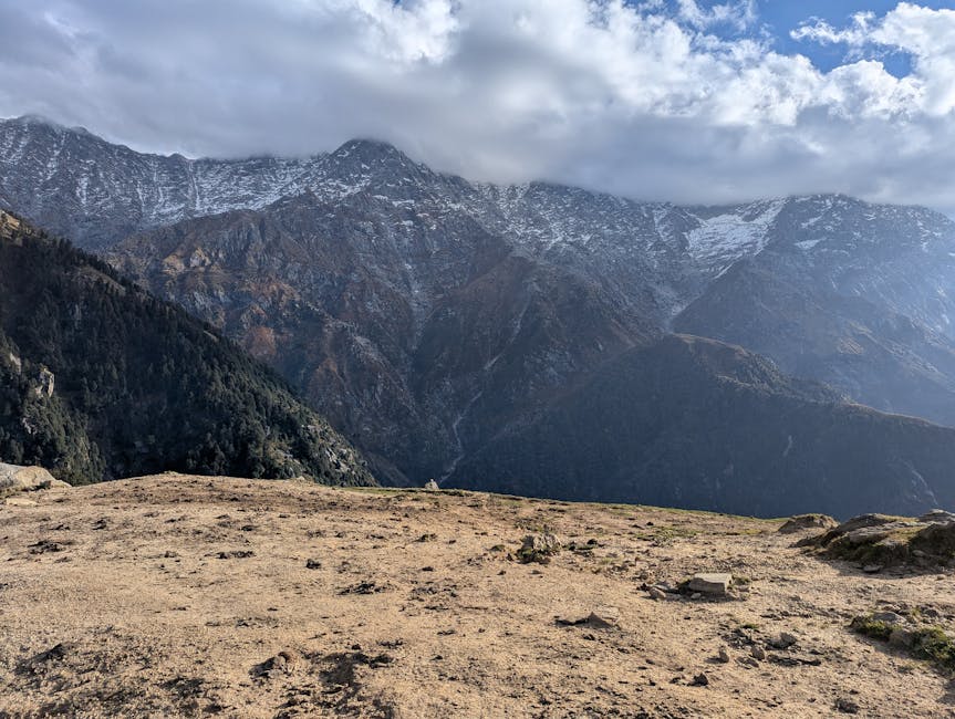 Snow-capped peaks of Himachal Pradesh under a blue sky