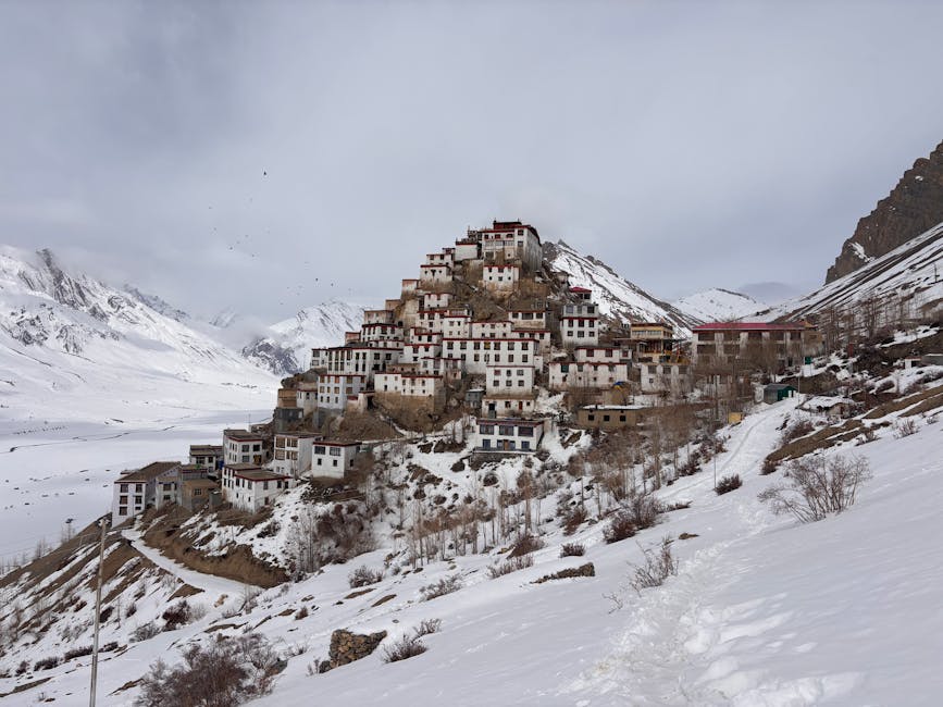 Kibber village in winter under snow, the base for snow leopard tracking trips.